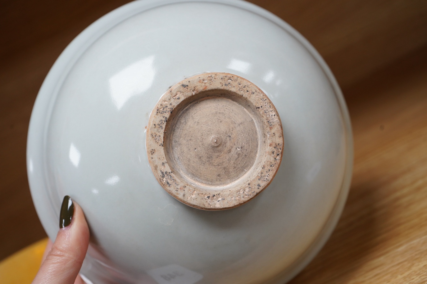 A Chinese celadon bowl and a fine yellow and brown decorated bowl, yellow bowl 9cm diameter. Condition - good